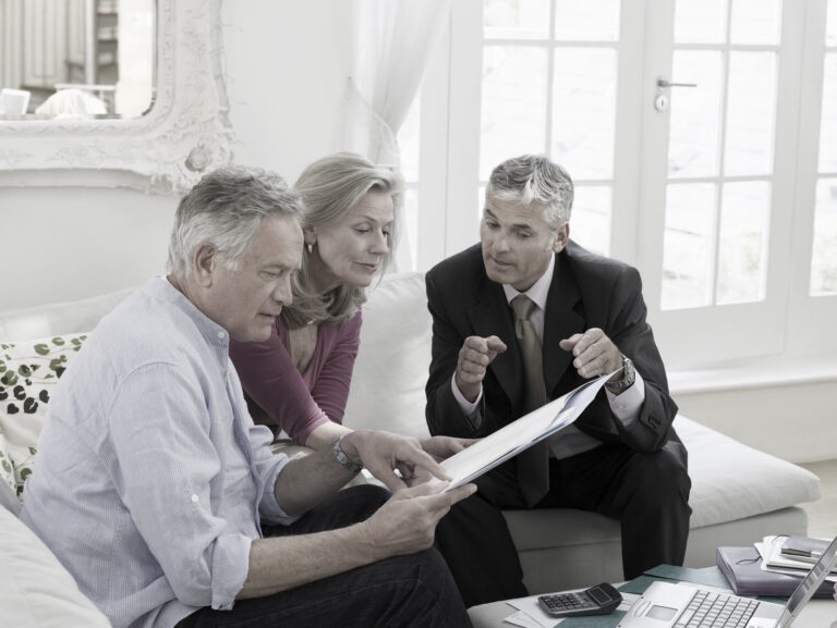 agent meeting with sellers in their home